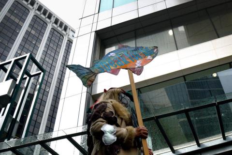 A demonstrator wears representations of sea lice outside the Fisheries and Oceans Canada offices in downtown Vancouver Sept. 24, demanding more action on the Cohen Commission recommendations to protect wild Fraser River sockeye